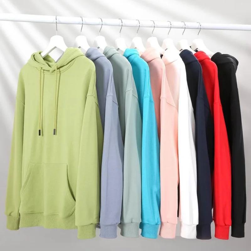 Pullover hoodies in multiple colors on white hangers — user-provided reference photograph